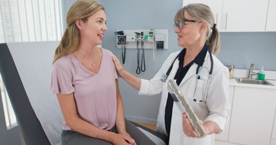 urgent care room doctor and patient